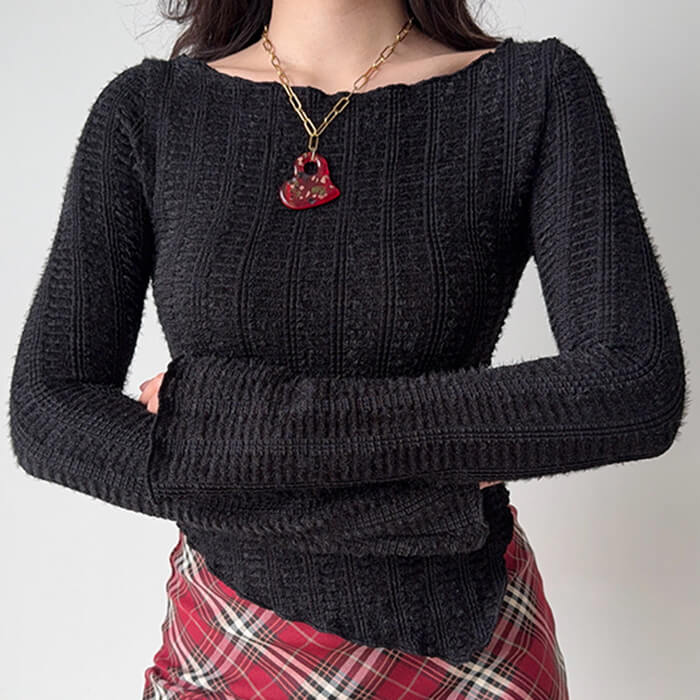 frazzled english woman asymmetrical knit top